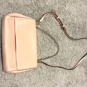 Kate Spade purse in the color pink.